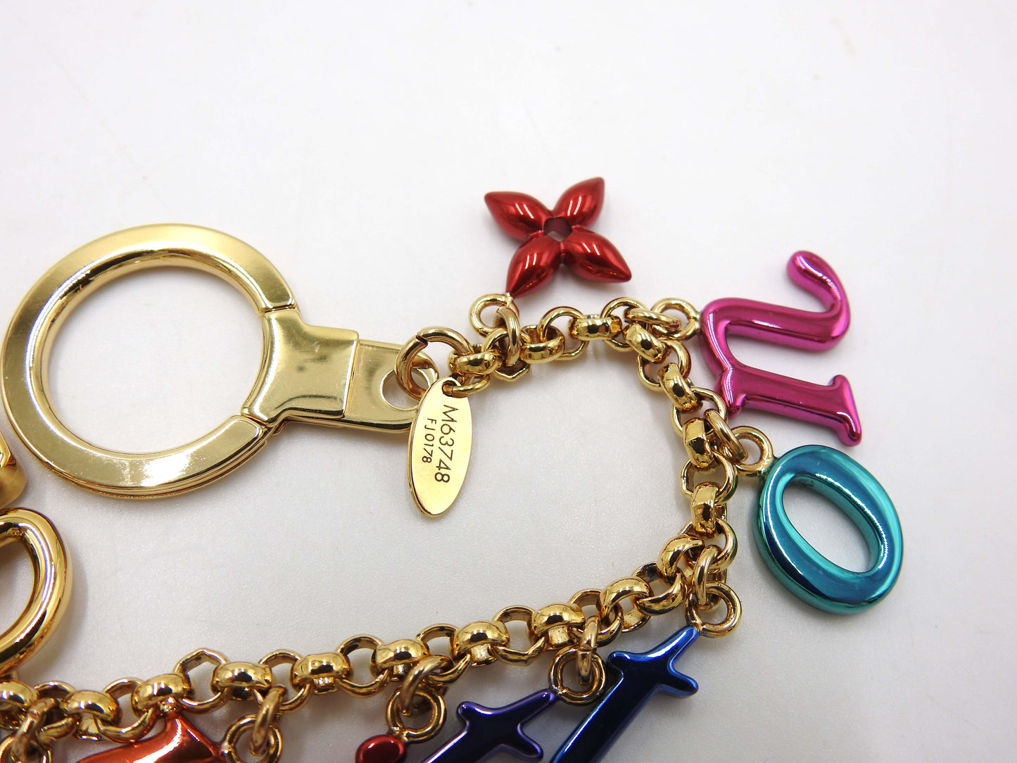 LOUIS VUITTON New Wave Chain Bag Charm Gold Multicolor M63748